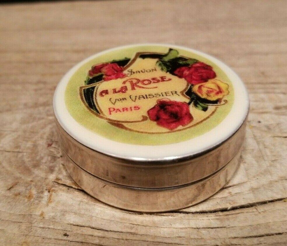 Small Round Powder Tin French Tinware: 1 7/8" round x 3/4" Wonderful reproduction powder tin! Keep everything from jewelry to coins safe in this beautiful, retro-chic Savon a la Rose box. Inspired by vintage finds from London and Paris ant