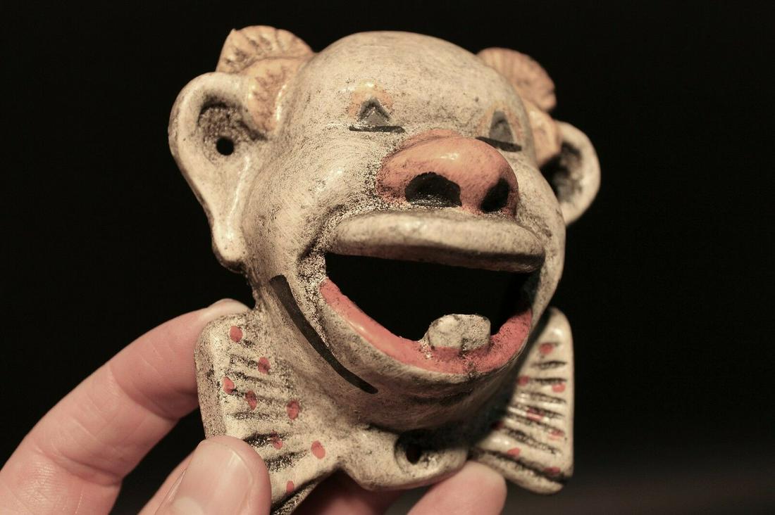 Cast Iron folk art Clown Wall mount Bottle Opener: 4" Tall x 3 3/4" Wide Great reproduction cast iron bottle opener. This piece was made to look just like an antique, but is new. Reserve: $14.00 Shipping: Domestic: Flat-rate of $6.00 to anywhere withi