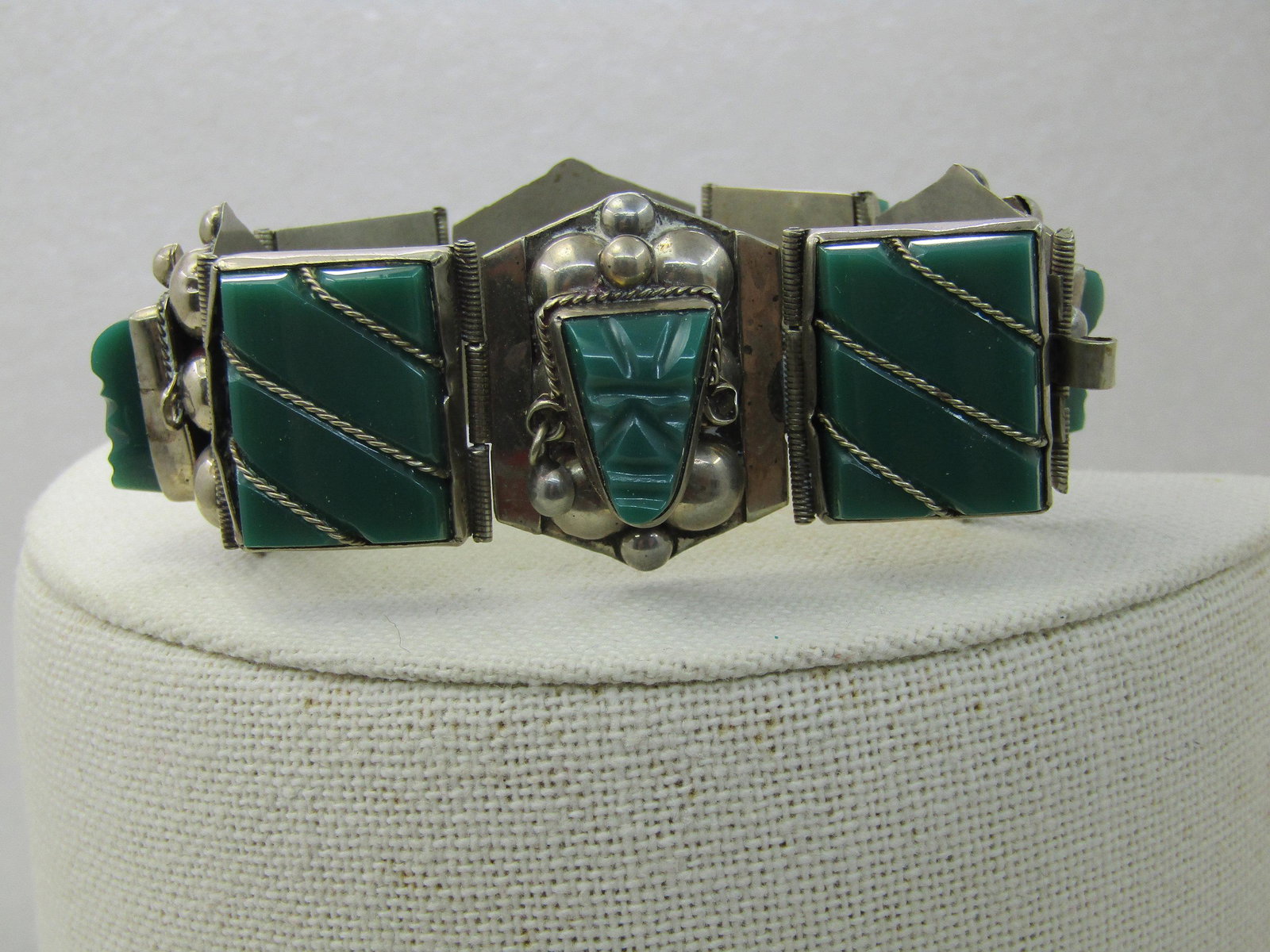 Vintage Taxco Carved Chrysoprase Bracelet, 7.25": Vintage Taxco Carved Chrysoprase Bracelet, 7.25" long and appx. 1-1/8" tall. Marked sterling, Taxco, Mexico. 8 links varying between 2 types, a wrapped rectangular link and a carved mask, bezel-set wi