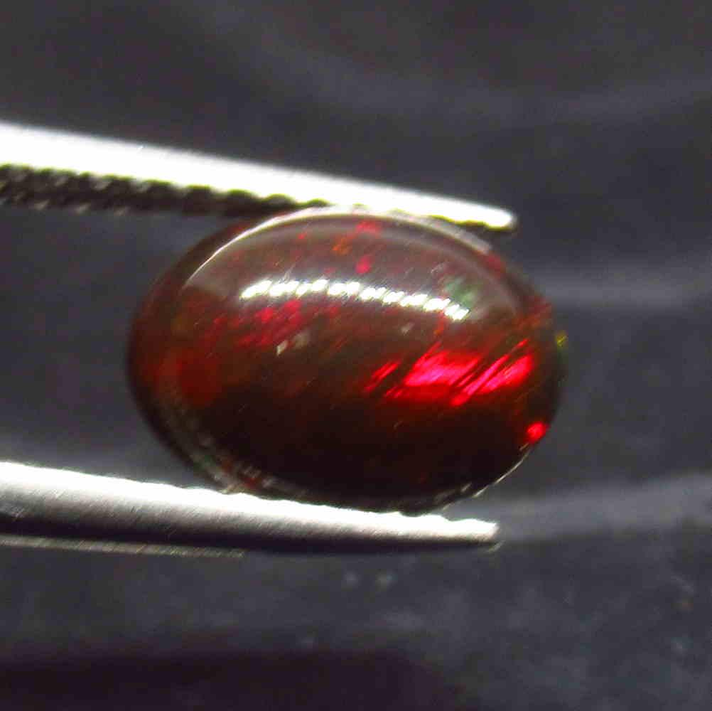 1.18 Ctw Natural Ethiopian Black Fire Opal Oval Cab: No Reserve! Title: 1.18 Ctw Natural Ethiopian Black Fire Opal Oval Cab Stone Clarity: Translucent Gemstone: Black Opal Carat Weight: 1.18 Size/Dimensions: 9.00 x 7.00 x 4.30 mm Additional Information:
