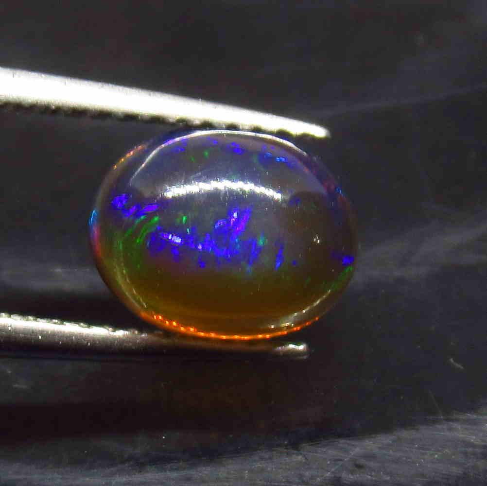 1.50 Ctw Natural Ethiopian Black Fire Opal Oval Cab: No Reserve! Title: 1.50 Ctw Natural Ethiopian Black Fire Opal Oval Cab Stone Clarity: Translucent Gemstone: Black Opal Carat Weight: 1.50 Size/Dimensions: 9.00 x 7.00 x 4.50 mm Additional Information: