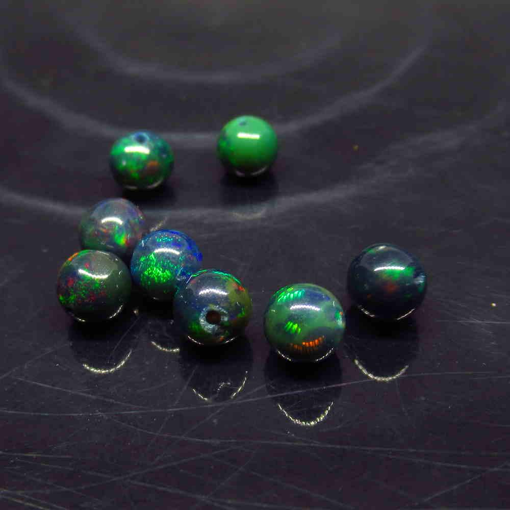 3.74 Ct Natural 8 Drilled Black Fire Opal Ball Beads: No Reserve! Title: 3.74 Ct Natural 8 Drilled Black Fire Opal Ball Beads Stone Clarity: Translucent Gemstone: Natural Black Opal Beads Carat Weight: 3.74 Size/Dimensions: 4.80 to 5.10 mm / 8 PC's Addit