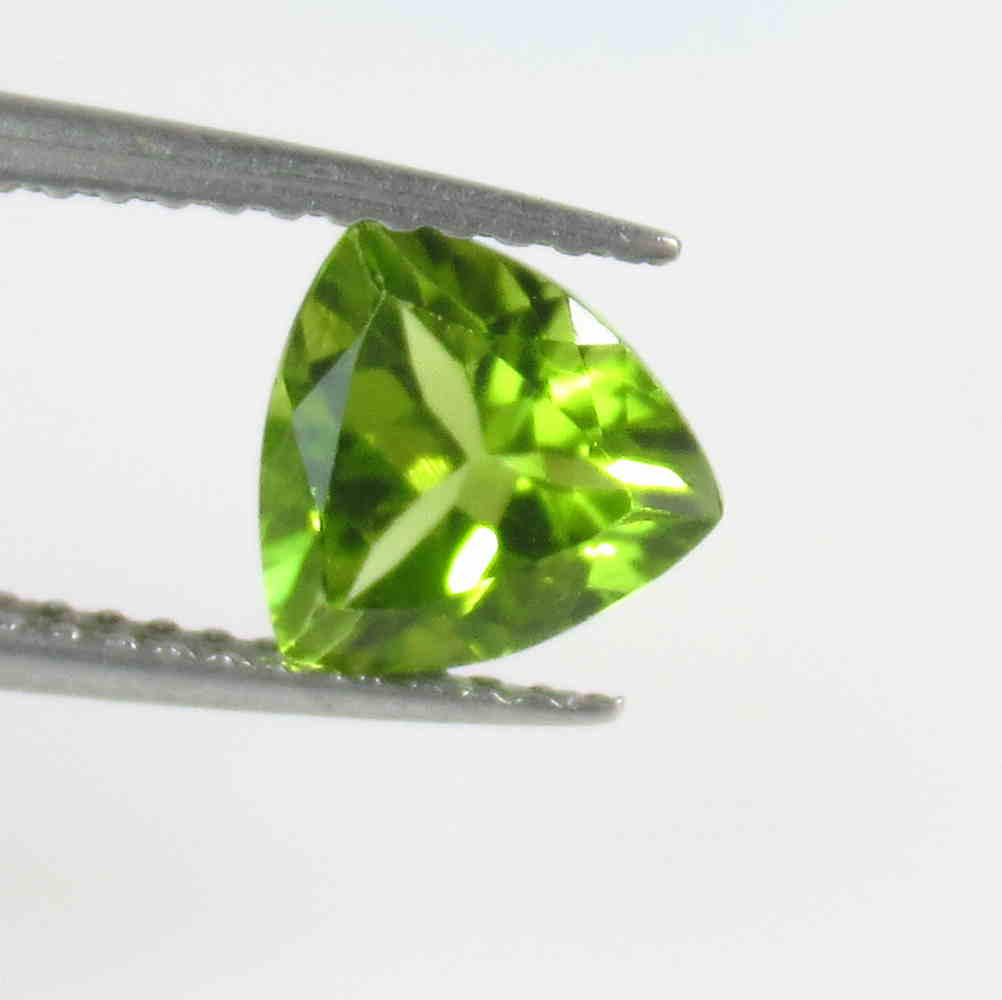 1.24 Ct Natural Pakistan Peridot Trillion Cut: No Reserve! Title: 1.24 Ct Natural Pakistan Peridot Trillion Cut Stone Clarity: VVS Gemstone: Natural Peridot Carat Weight: 1.24 Size/Dimensions: 7.00 x 7.00 x 4.00 mm Additional Information: Top Clas