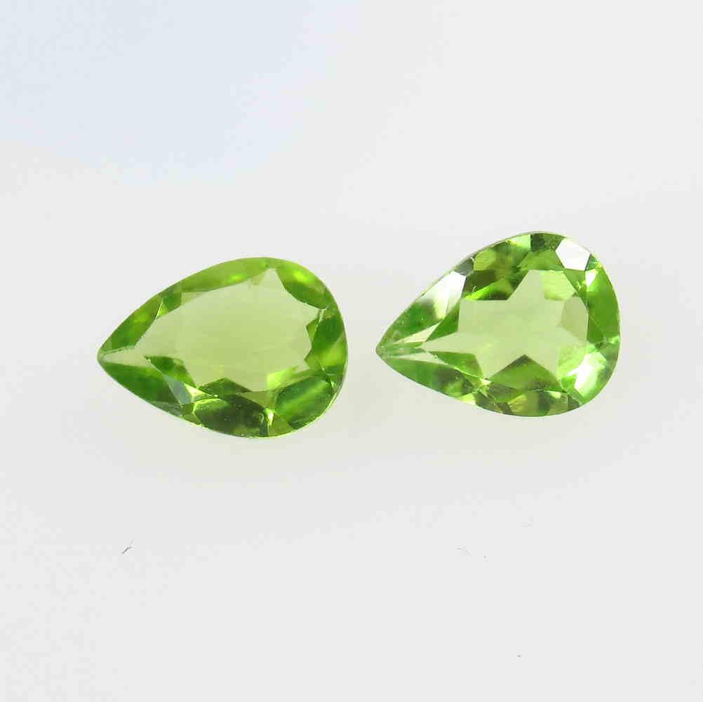 2.08 Ct Natural Pakistan Peridot Pear Pair: No Reserve! Title: 2.08 Ct Natural Pakistan Peridot Pear Pair Stone Clarity: VVS Gemstone: Natural Peridot Carat Weight: 2.08 Size/Dimensions: 8.20 x 6.10 x 3.50 mm / 2 PC's Additional Information: To