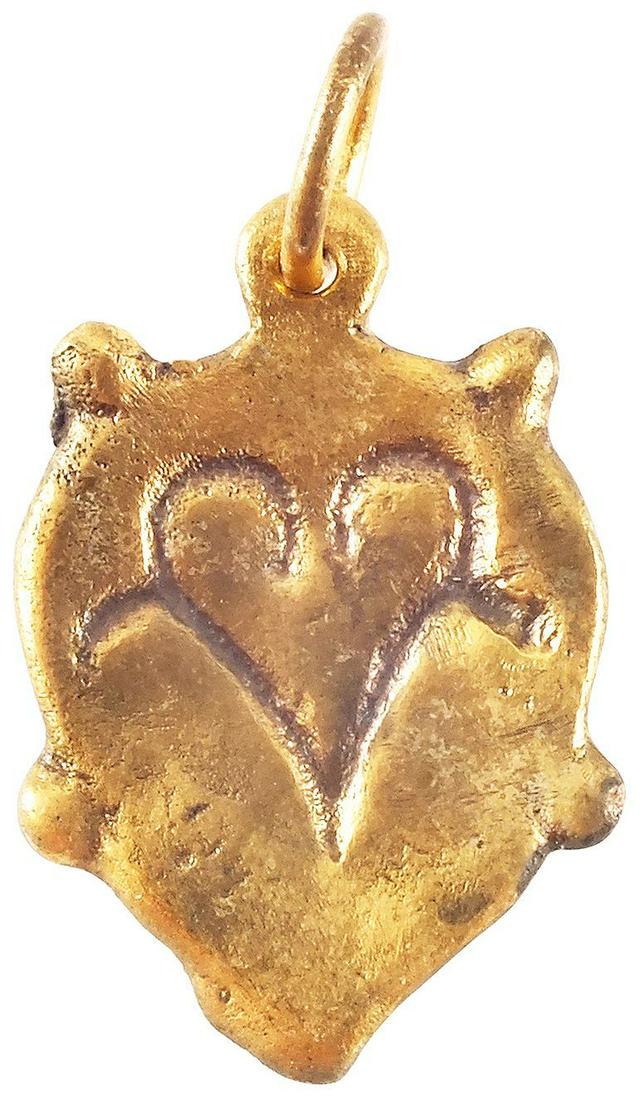 VIKING HEART PENDANT C.850-1050 AD JEWELRY: 7/8" height. Four nubs to the edge and addorsed goliate figures forming a heart. A heart within a heart. . Thick, relatively flat section, produced by the open face mold technique. The heart stood for