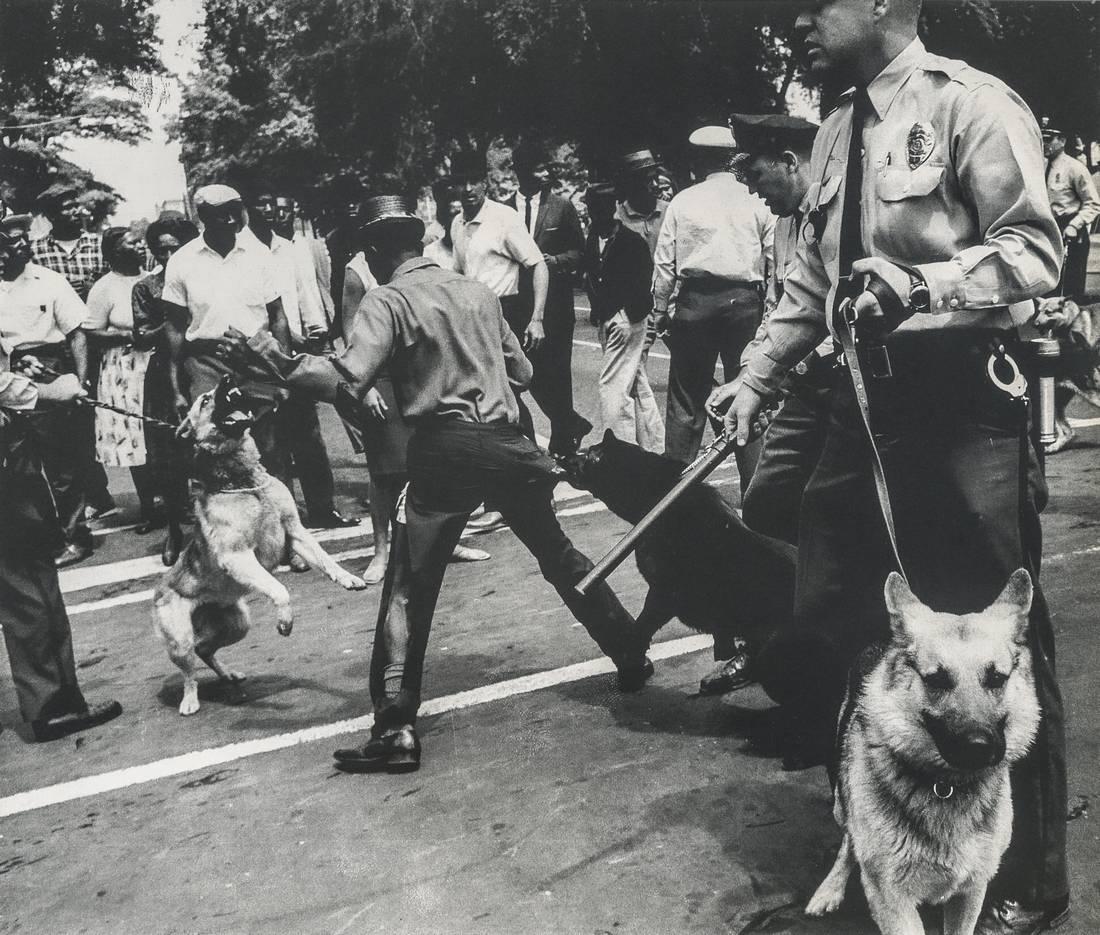 CHARLES MOORE - Birmingham, Alabama, 1963: Artist: CHARLES MOORE Title: Birmingham, Alabama, 1963 Medium: Photo Litho, 1988, USA Dimensions: 9.65x8.15" Description: Heat Wax Mounted on 11x14" Conservation Board The Story: In the summer of 1963