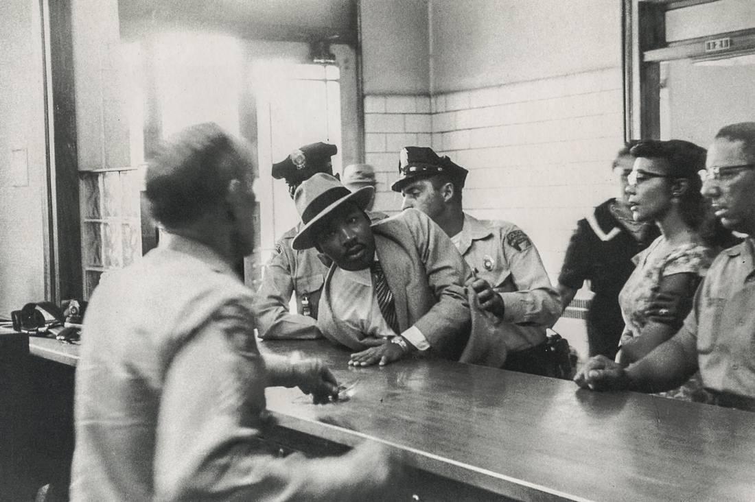 CHARLES MOORE - ML King Being Arrested in Montgomery: Artist: CHARLES MOORE Title: ML King Being Arrested in Montgomery Medium: Photo Litho, 1999, Hong Kong Dimensions: 8.55x5.7" Description: Heat Wax Mounted on 8.5x11" Conservation Board The Story: On S