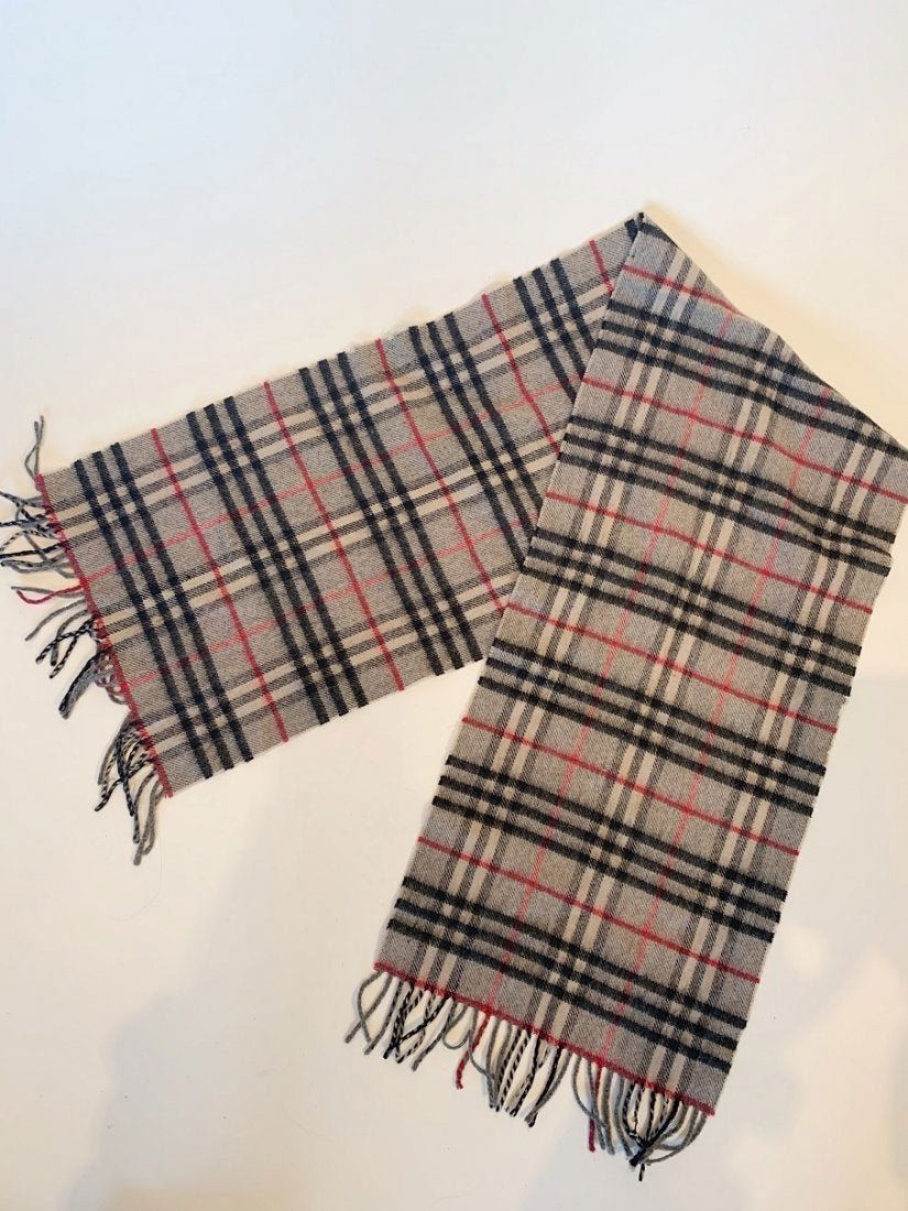 Grey Burberry Plaid Scarf: Title: Grey Burberry Plaid Scarf Brand: Burberry Date: 1990s Materials: Wool Measurement: Additional Information: Burberry Wool scarf with plaid print. This is vintage with slight fraying and signs of
