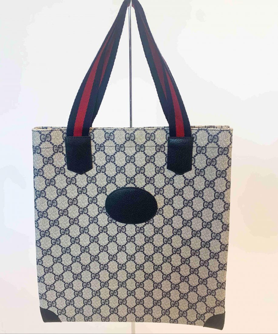 Gucci Supreme Navy Tote: Title: Gucci Supreme Navy Tote Brand: Gucci Date: 1990s Materials: Leather Measurement: Length 12" Height 13" Width 1.5" Additional Information: Gucci Supreme navy tote in excellent conditon Reserve: