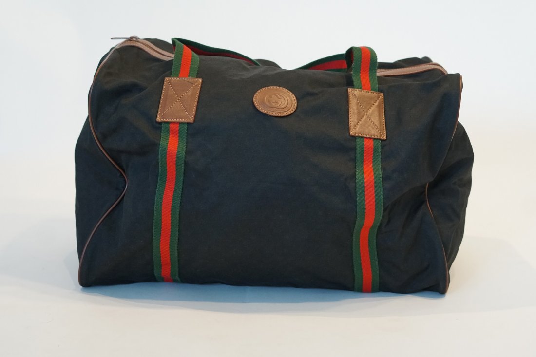 Gucci black micro gg foldable travel bag: Title: Gucci black micro gg foldable travel bag Brand: Gucci Date: 1980s Materials: Canvas Measurement: L18 W10 H12 SD8 Additional Information: Gucci black micro gg travel bag. Cloth with red and gree