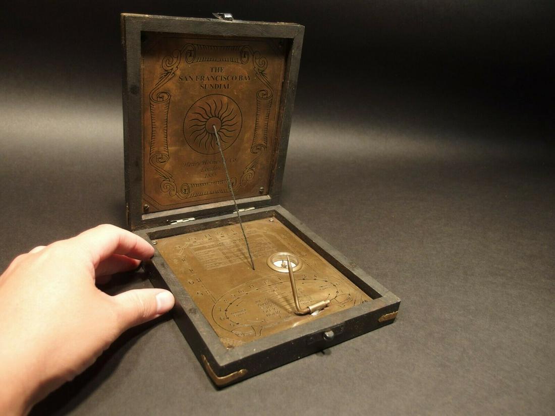 Sundial Compass Instrument Henry Holmes 1885: 6" x 7" x 1 /2" thick Such a neat reproduction antique instrument! This is the San Francisco Bay Sundial by Henry Holmes co. 1885 made much like the original would have been made. The brass instrument