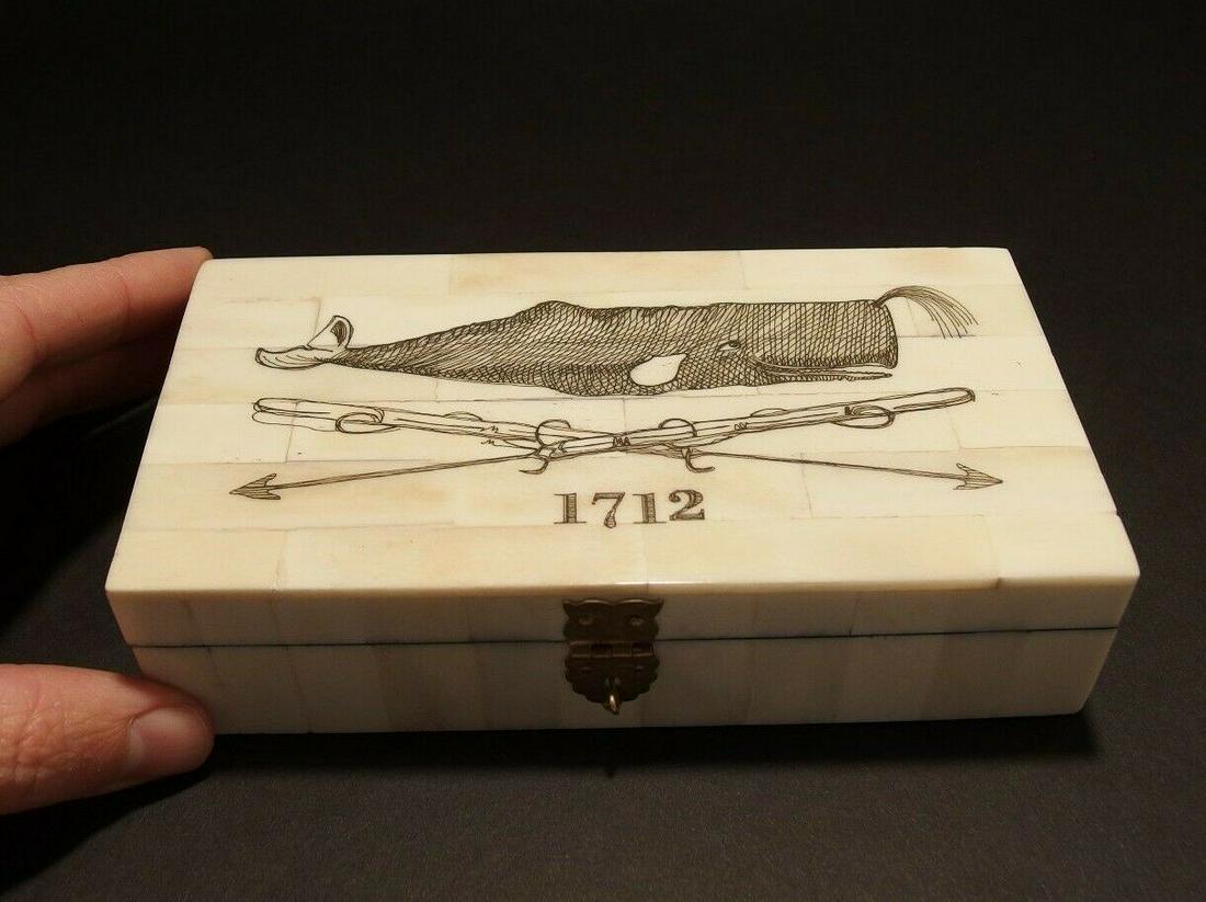 Folk Whale Harpoon Scrimshaw Bone & Wood Trinket Box: 6 3/8" Long x 3 7/8" Wide x 1 5/8" High Wonderful new reproduction scrimshaw carved ox bone box. As you can see this piece is tiled with bone on wood and decorated with a design typical of the period.