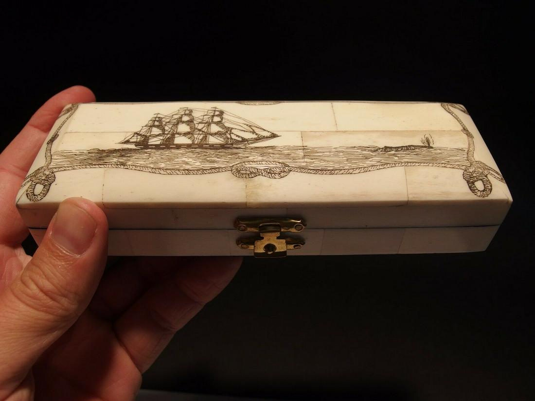 Whale Chase Scrimshaw Etched Bone & Wood Trinket Stamp: 6 1/4" Long x 2 1/4" Wide x 1 3/8" High Wonderful new reproduction scrimshaw carved ox bone box. As you can see this piece is tiled with ox bone on wood and decorated with a design typical of the peri