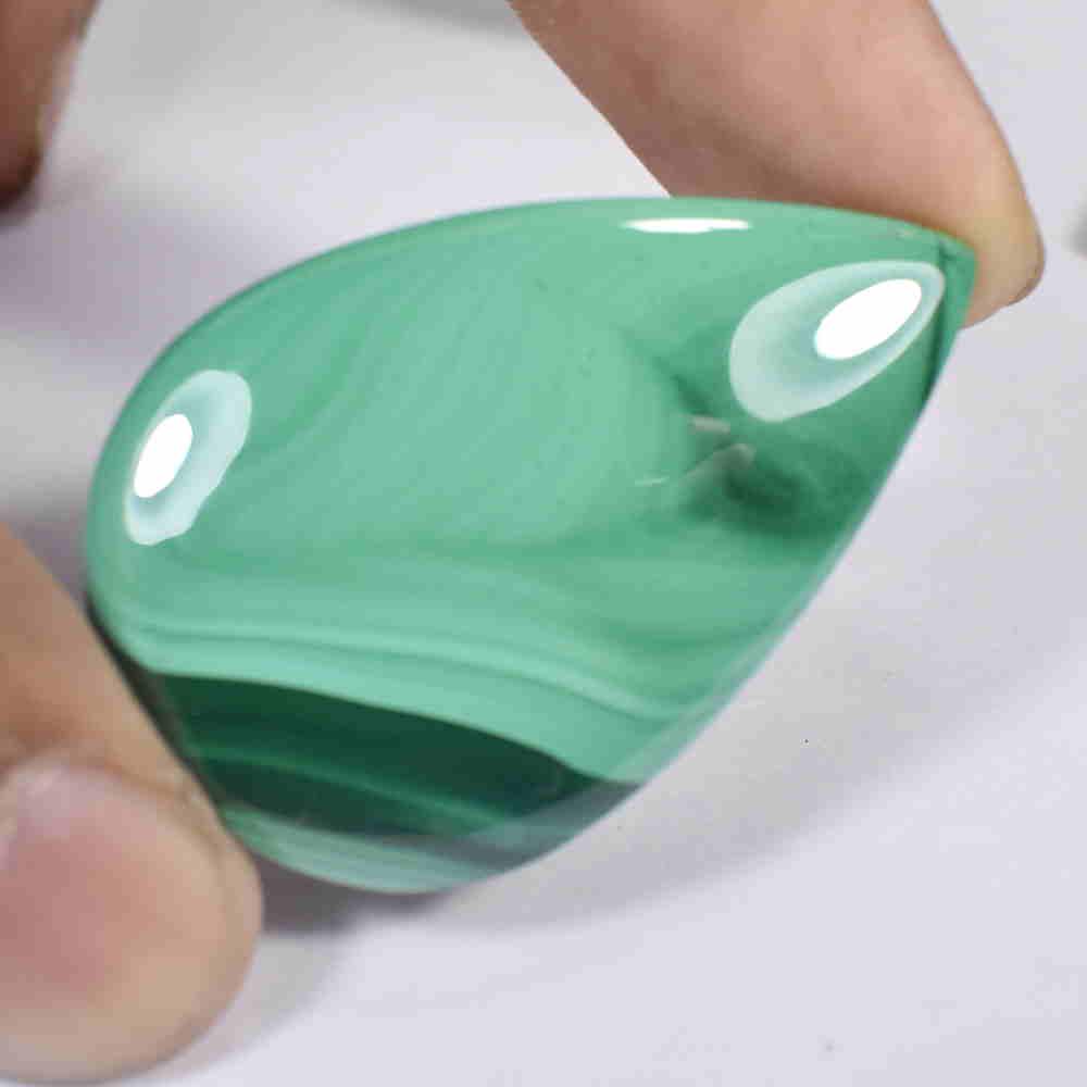 82.47 Ct Natural Green Malachite 42x27mm Pear Cab: No Reserve! Title: 82.47 Ct Natural Green Malachite 42x27mm Pear Cab Stone Clarity: Opaque Gemstone: Natural Malachite Carat Weight: 82.47 Size/Dimensions: 42.00 x 27.00 x 7.00 mm Additional Informati