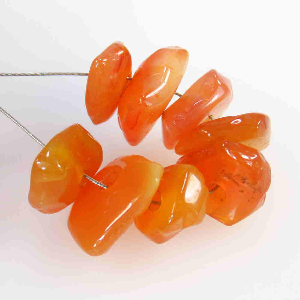 20.58 Ct Natural 8 Drilled Carnelian Unshaped Beads: No Reserve! Title: 20.58 Ct Natural 8 Drilled Carnelian Unshaped Beads Stone Clarity: Semi-Transparent Gemstone: Natural Carnelian Beads Carat Weight: 20.58 Size/Dimensions: 8.1x3.6 - 11.8x5.0 mm / 8 