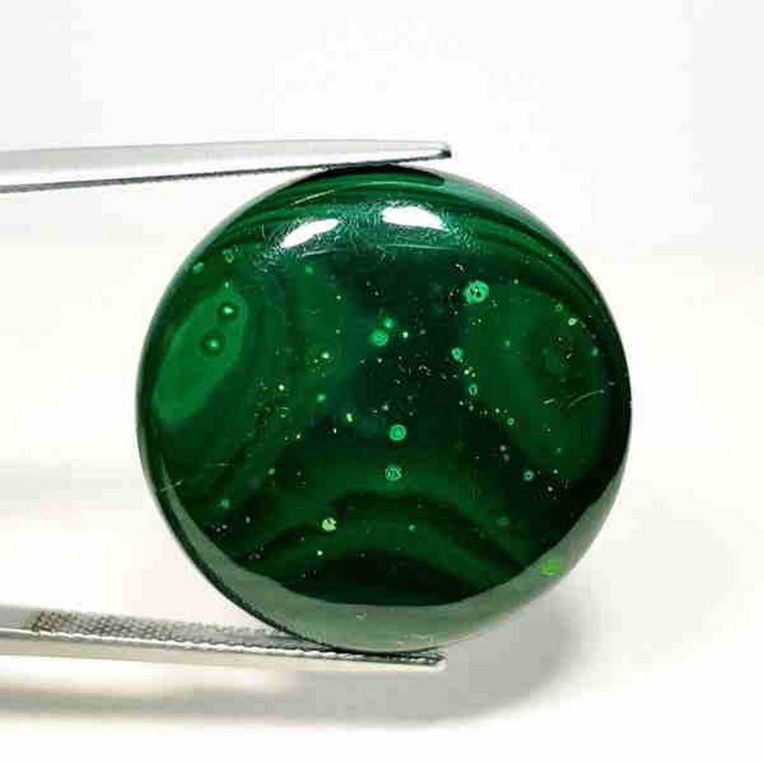 39.65 ct Natural Malachite: No Reserve! Title: 39.65 ct Natural Malachite Color/Clarity: Opaque Gemstones: Loosegemstone Carat Weights: 39.35 Size/Dimensions: 25.20 x 25.20 x 5.10 Additional Information: Round - USA/Egypt Shippi
