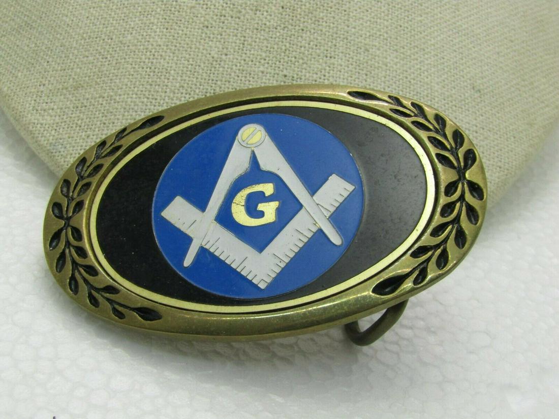 Vintage Enameled Masonic Buckle by Heritage Buckles,: Vintage Enameled Masonic Buckle by Heritage Buckles, Brass, 1.75" belt opening, 3-3/8" wide and 2.25" tall wotj p;ove branch on outside frame on both sides, recessed oval center with black enameling o