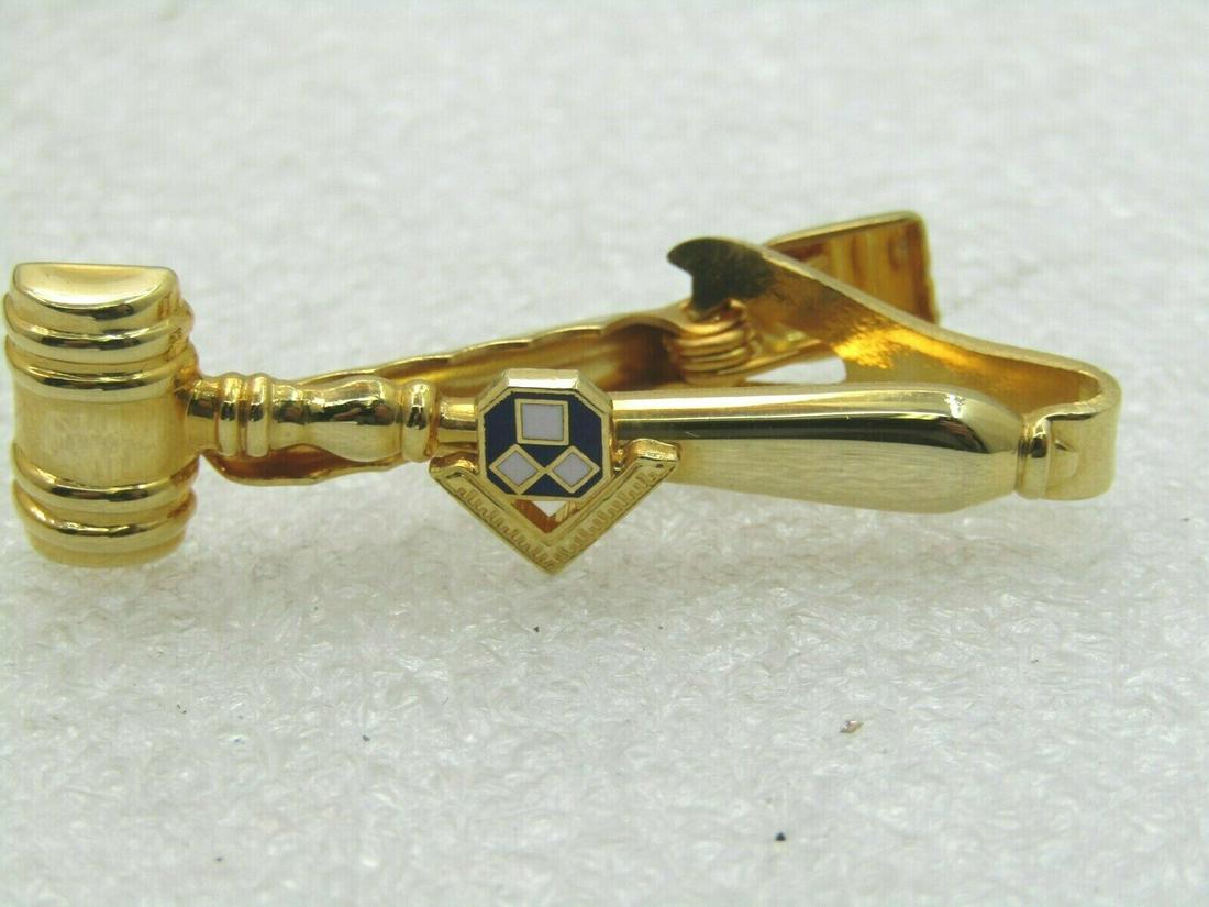 Vintage Masonic Gavel Tie Clasp with Enameling, Gold: Vintage Masonic Gavel Tie Clasp with Enameling, Gold Tone, 1-7/8" long and slightly over 1/2" at the gavel. It has a blue and white enameled section over the iconic square for the Masons. It is not si