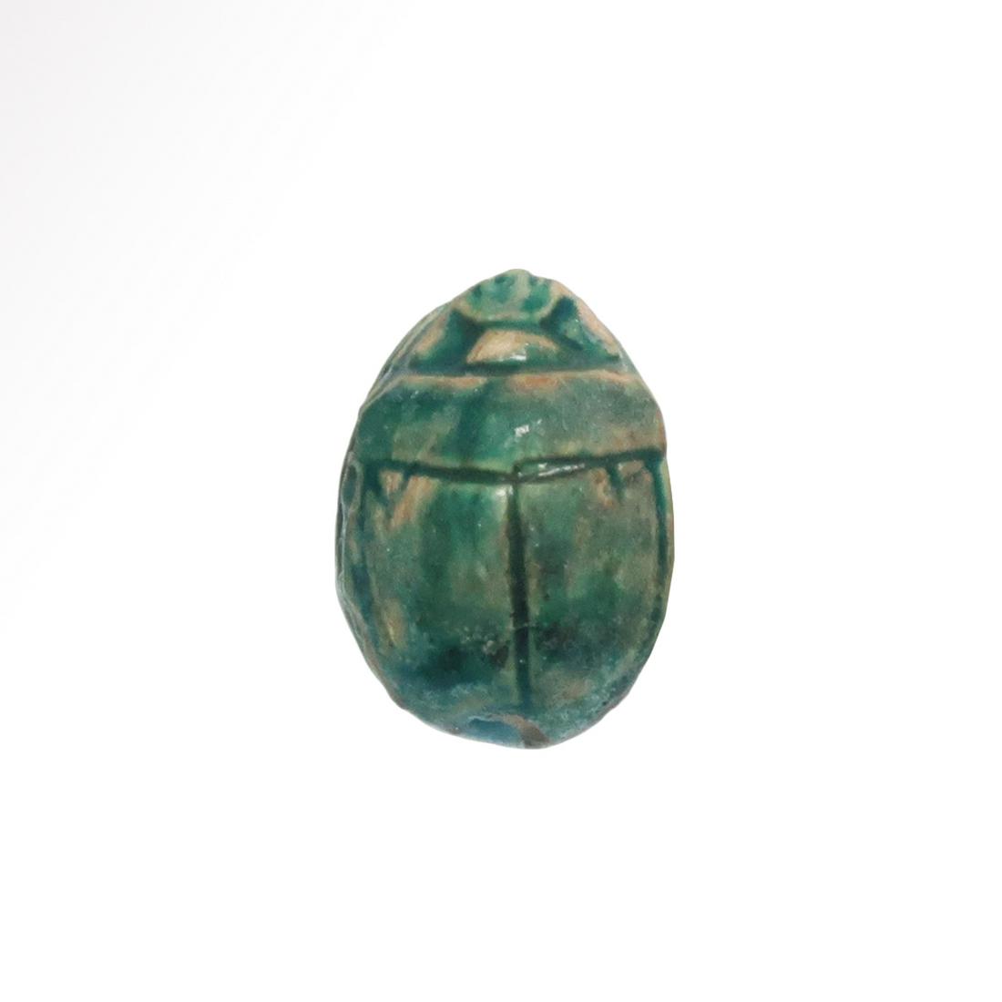 Egyptian Glazed Steatite Scarab, Royal Goose: Title: Egyptian Glazed Steatite Scarab, Royal Goose Date & Origin: Egypt, c. 600 B.C. Material: Steatite Dimension: 1.3 cm L - 5/8 inch Additional Information: Steatite scarab, the underside carved wi