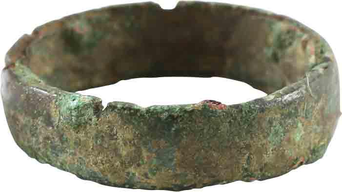 ANCIENT VIKING WEDDING RING C.850-1050 AD JEWELRY, SZ 7: Rounded face band of 5.6mm width. Size 7. The inside with evidence of having been made with a centeral core to distribute the molten metal, later removed. Good preservation as found with uniform heavy