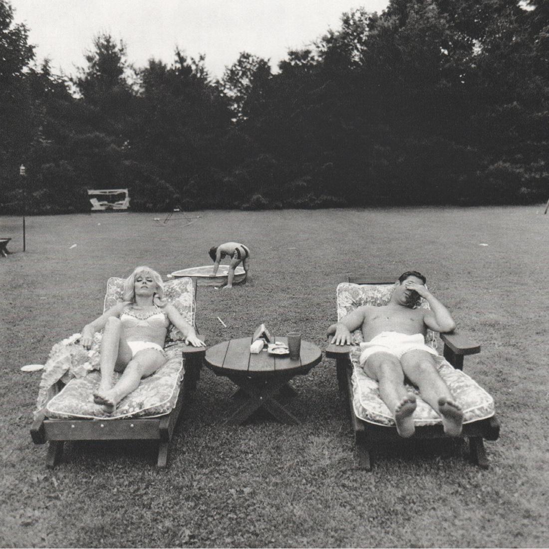 DIANE ARBUS - Family on their Lawn: Artist: DIANE ARBUS Print Title: Family on their Lawn one Sunday in Westchester New York, 1968 Medium: Sheet-fed Gravure Printing Date: 1970's Printed in Switzerland Image Size: 7 x 7 inches Diane Arb