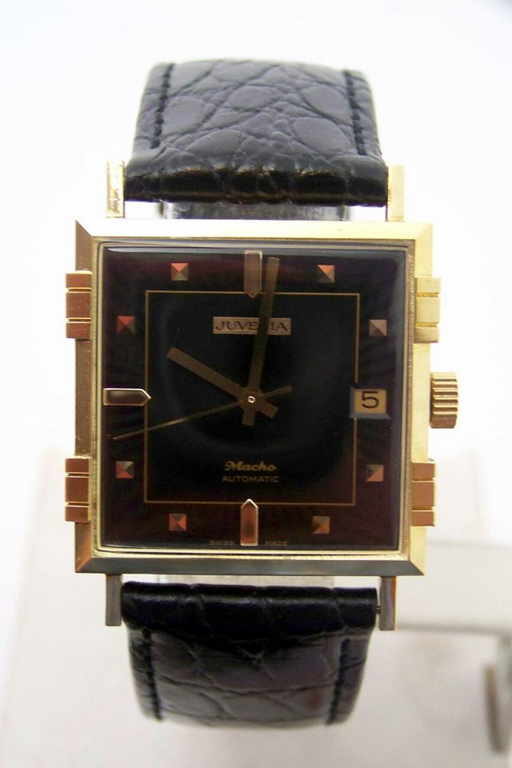 NOS 18K Gold JUVENIA MACHO Mens 25J AUTOMATIC Watch: Description NOS 18K Gold JUVENIA MACHO Mens 25J AUTOMATIC Watch 8902 Black Dial & 4Bars Case This MenÂ’s Juvenia watch is Swiss made Great present for watch collectors & enthusiasts! * Solid 18k Ye