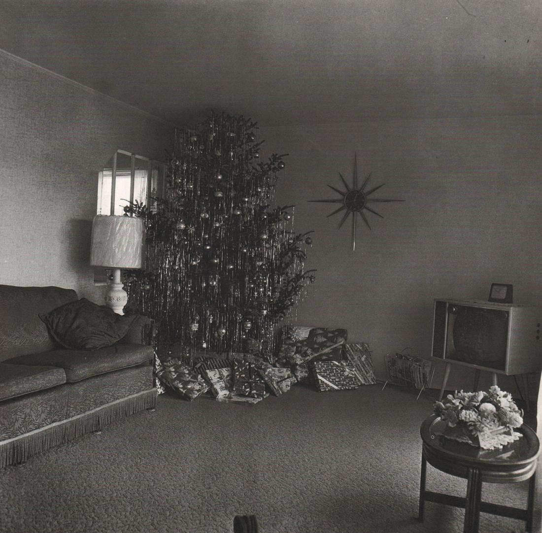 DIANE ARBUS - Xmas Tree in a living room in Levittown,: Artist: DIANE ARBUS Print Title: Xmas Tree in a living room in Levittown, LI, 1963 Medium: Photoengraving Printed 1970’s in the US Image size (inches) approx. 8 x 8” Diane Arbus (1923 –1971),was