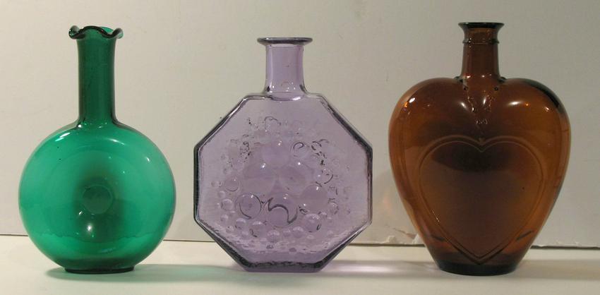 Group of three older glass window bottles.: Title: Group of three older glass window bottles. Provenance/Additional Info: Group of three older glass window bottles. Dimension: highest is 8” tall Circa:1960's Shipping: Domestic: Flat-rate of $