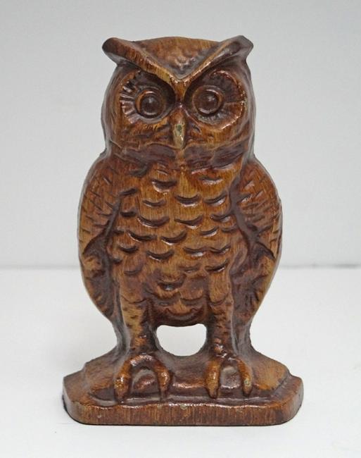 Antique Cast Iron Owl Doorstop: Title: Antique Cast Iron Owl Doorstop Origin: Date: Circa 1930s Dimension: 6 ½” tall x 4 3/8 wide Provenance/Additional Info: Wonderful detailed cast iron Owl perched on tiered base. Signed and num