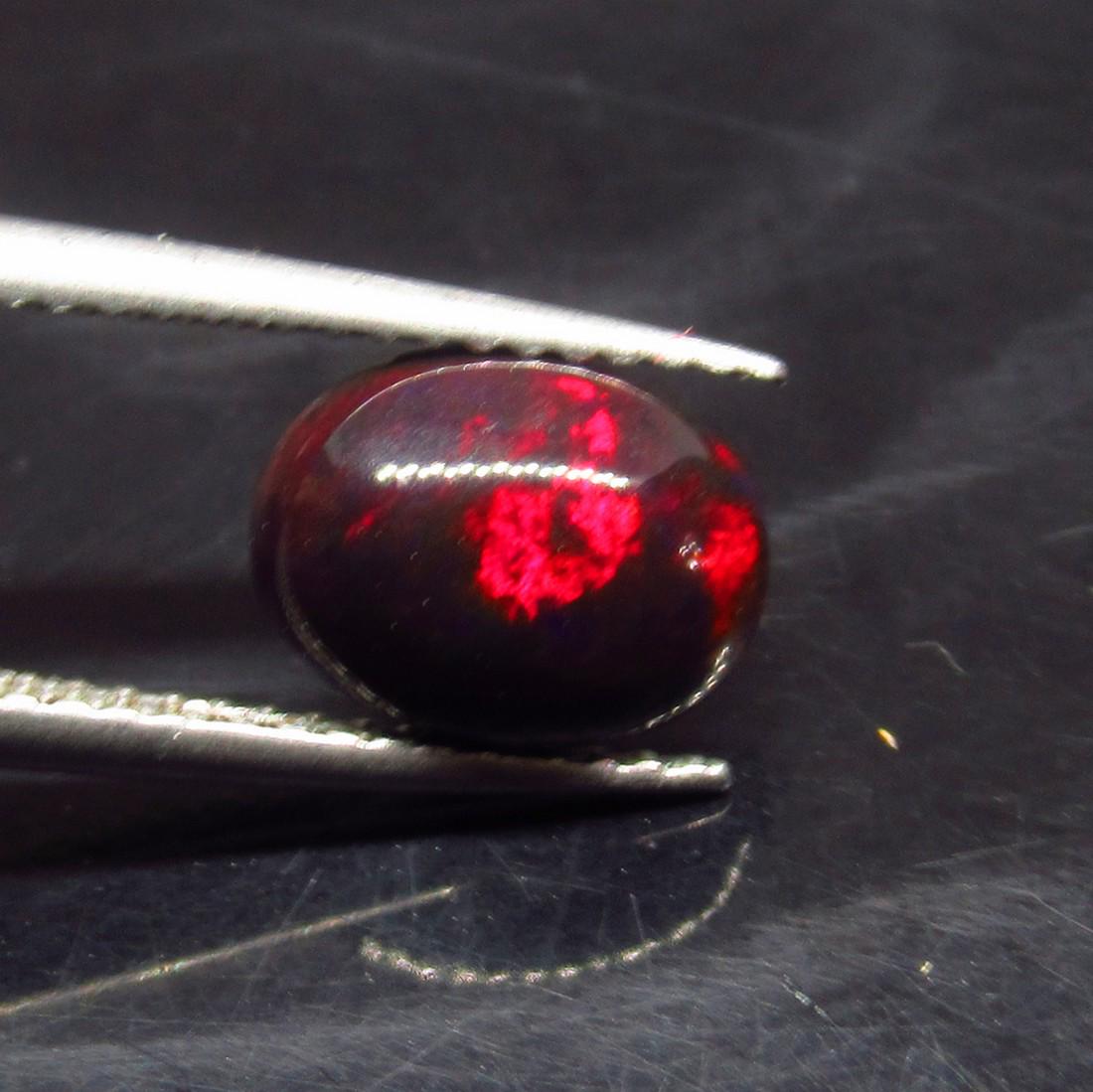 1.35 Ct Natural Ethiopian Black Fire Opal Oval Cab: No Reserve! Title: 1.35 Ct Natural Ethiopian Black Fire Opal Oval Cab Stone Clarity: Translucent Gemstones: Natural Black Opal Carat Weights: 1.35 Size/Dimensions: 9.30 x 7.10 x 4.00 mm Additional Inf