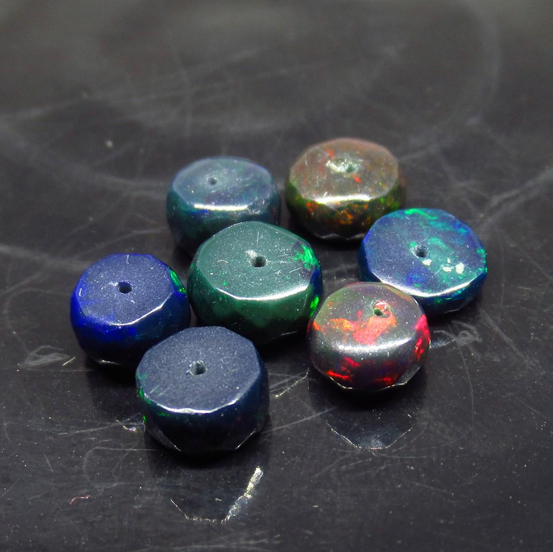 8.53 Ct Natural 7 Drilled Black Fire Opal Ball Beads: No Reserve! Title: 8.53 Ct Natural 7 Drilled Black Fire Opal Ball Beads Stone Clarity: Translucent Gemstones: Natural Black Opal Beads Carat Weights: 8.53 Size/Dimensions: 7.10 to 8.00 mm / 7 PC's Add