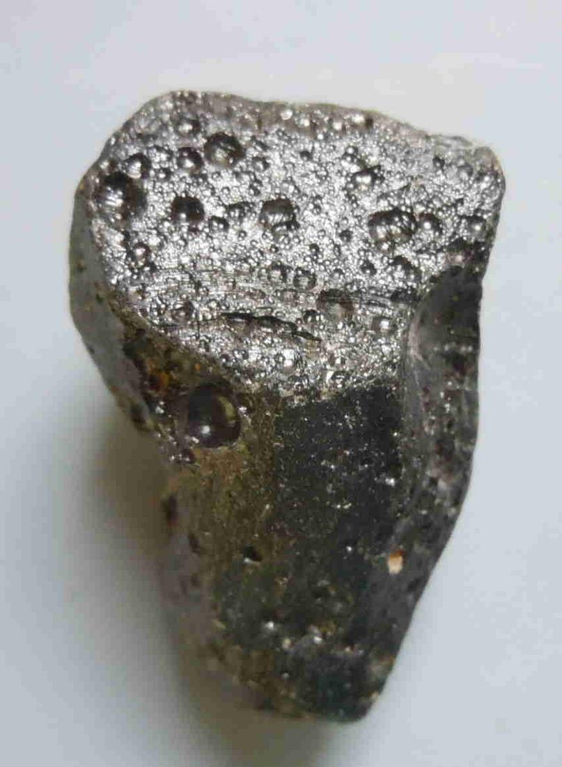 PHILIPPINITE TEKTITE - FROM METEORITE IMPACT: Title: PHILIPPINITE TEKTITE - FROM METEORITE IMPACT Origin: Paracale, Camarines Norte, Luzon, Philippines Size: 3.5x2x1.5 cm / 17 gram Description: irregular shaped rizalite/philippinite tektite with