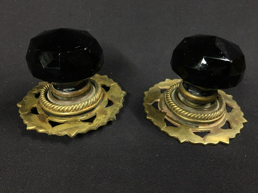 Fabulously ornate black faceted glass Victorian door: Title: Fabulously ornate black faceted glass Victorian door knobs with cast brass door plates. Date/Period: Late Victorian (about 1890) Materials: Faceted cast solid black glass knobs set into cast br