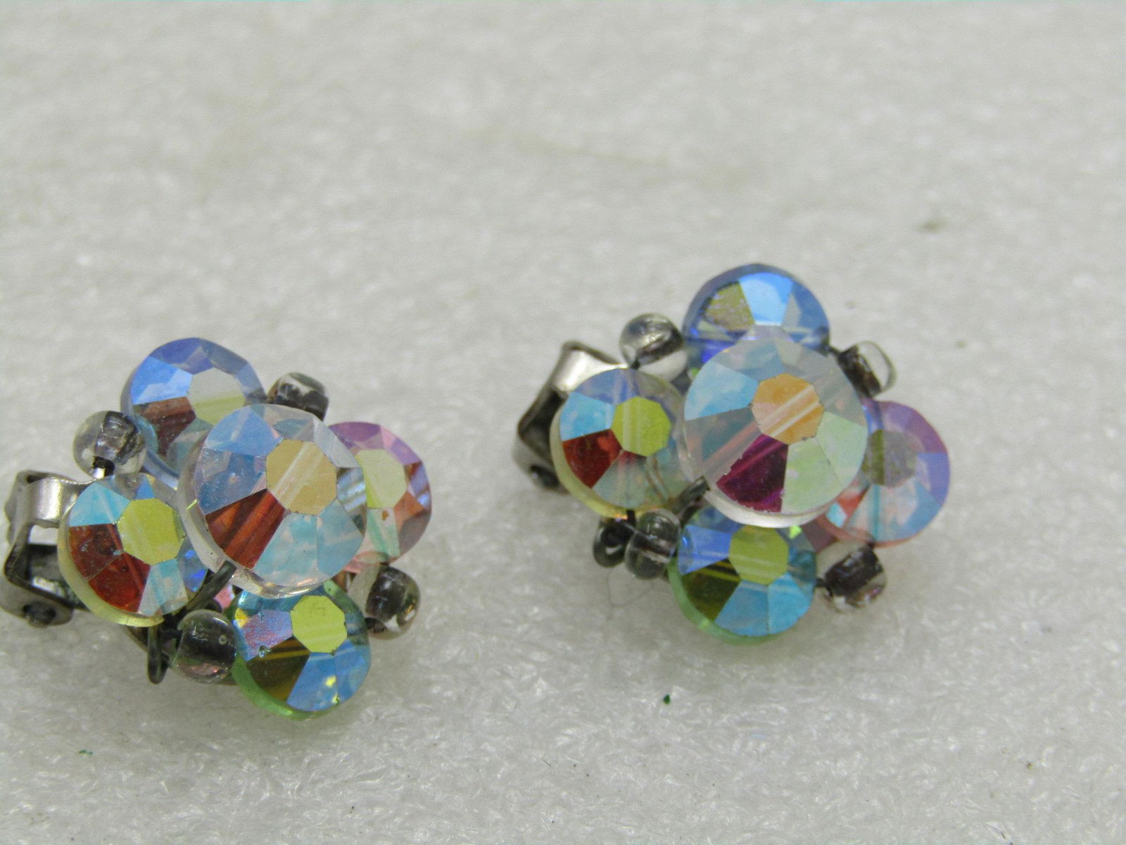 Vintage Aurora Borealis Cyrstal Earrings, Clip,: Vintage Aurora Borealis Crystal Earrings, Clip, 3/4" across, tiered with round faced crystal rhinestones set in silver tone. These are 1950's-1960's. They are not signed by the maker, are in very good