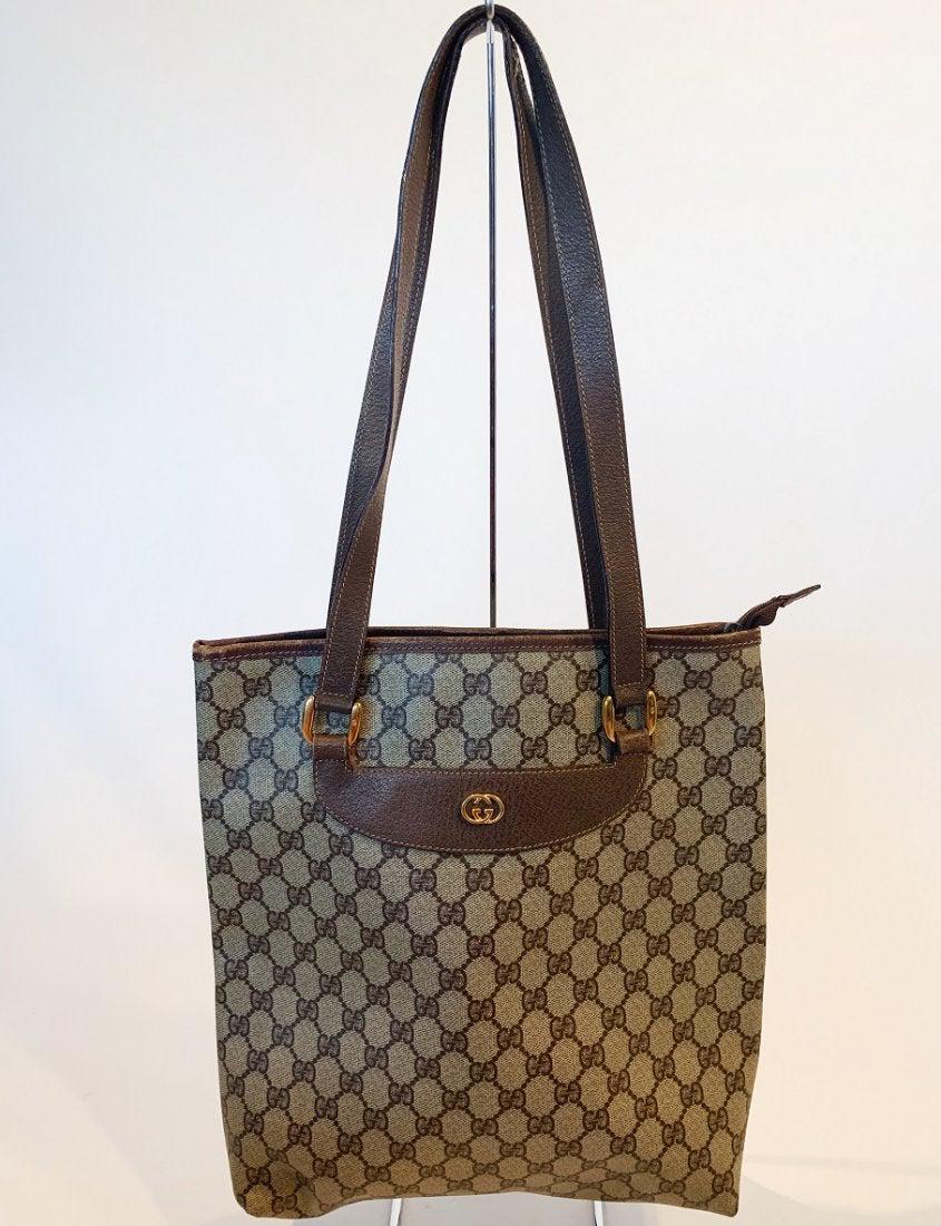 Gucci Beige Tote: Title: Gucci Beige Tote Brand: Gucci Date: 1980s Materials: PVC Measurement: L 14.5 W 3 H 10 Sd 12 Additional Information: Gucci Beige Tote. Has heavy wear on the handles and wear throughout refer to 