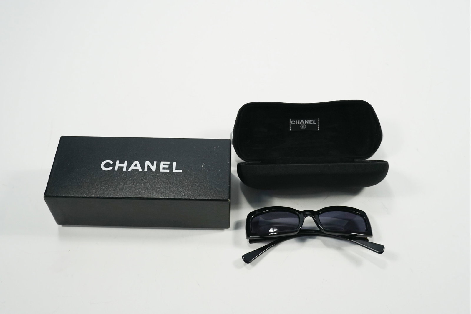 Chanel Sunglasses Black FULL SET with box: Title: Chanel Sunglasses Black FULL SET with box Brand/Designer: Chanel Dimension: L 13 W 2.5 H 7 Additional Information: Chanel Sunglasses Black FULL SET with box slight wear as preowned Reserve: $70