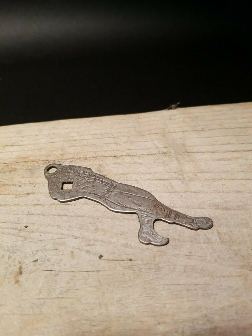 Cola Baseball Pitcher Player Bottle Opener: 3 1/8" Long Nice reproduction bottle opener shaped like a baseball pitcher. It says Drink Refreshing Moxie on one side then "Purity is sealed in a bottle" The opener is an old silver pewter color like
