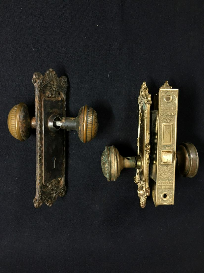 Pair Victorian knobs fancy back plates and iron lock: Title: Pair Victorian knobs fancy back plates and iron lock set Date/Period: 1880-1900 Materials: bronze knobs and back plates paired with an iron lock set Dimensions: lock set: W.4 x H.3.5 inches Kno
