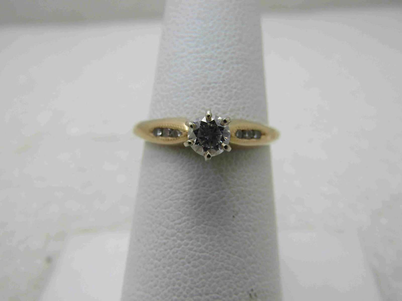 Vintage 14kt Diamond Engagement Ring, Sz. 7.25, 2.45: Vintage 14kt Diamond Engagement Ring, Sz. 7.25, 2.45 gr. Appx .33 ctw diamond, Color is appx. G/H, VS1, cut is goodVintage 14kt Diamond Engagement Ring, Sz. 7.25, 2.45 gr.There are three channel set .
