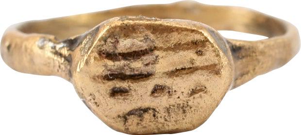MEDIEVAL WOMAN’S FASHION RING C.1000-1250 AD SIZE 4 ¼: Christian period, C.1000-1250 AD. Woman’s size 4 ¼. 1.5mm width band slightly flaring below the shoulders. Raised oval bezel with profusely figured in three bands, evidently abstractions with spiri