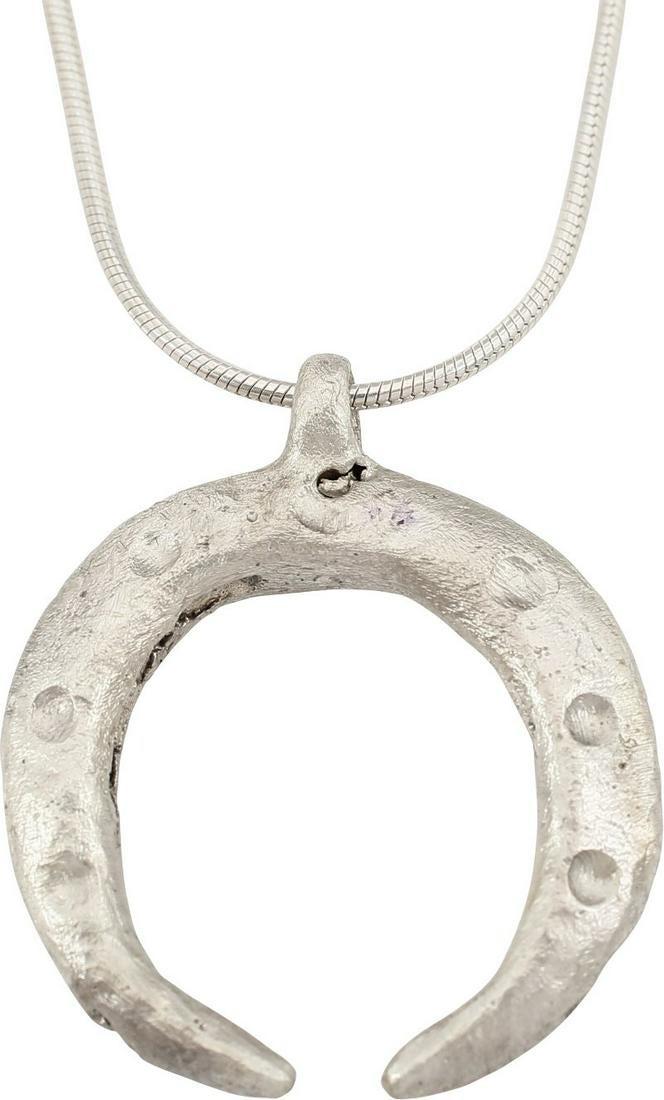 VIKING LUNAR PENDANT NECKLACE C.900-1000 AD JEWELRY: Just over 1” width of the bold form, rounded front, back and ridged edge. The crescent moon representing the God Mani, with three dots to each arm, signifying a particular astrological event that wo
