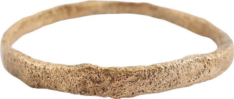 ANCIENT VIKING WEDDING RING, 850-1050 AD SIZE 9 ¼: Late 9th-early 11th century AD. Gilt bronze, size 9. Narrowband 2.3mm, expanding to 2.8mm at the top with a small indent (cipher?). Low rounded face. Surface textured from burial. Professionally refur