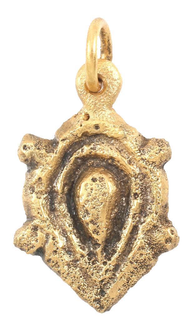 FINE VIKING HEART PENDANT C.900-1050 AD JEWELRY: About 7/8” height including the suspension loop. The heart in its natural form with a rounded top, double bordered. The sides with nubs at the six points, perhaps representing a saltire. For Vikings