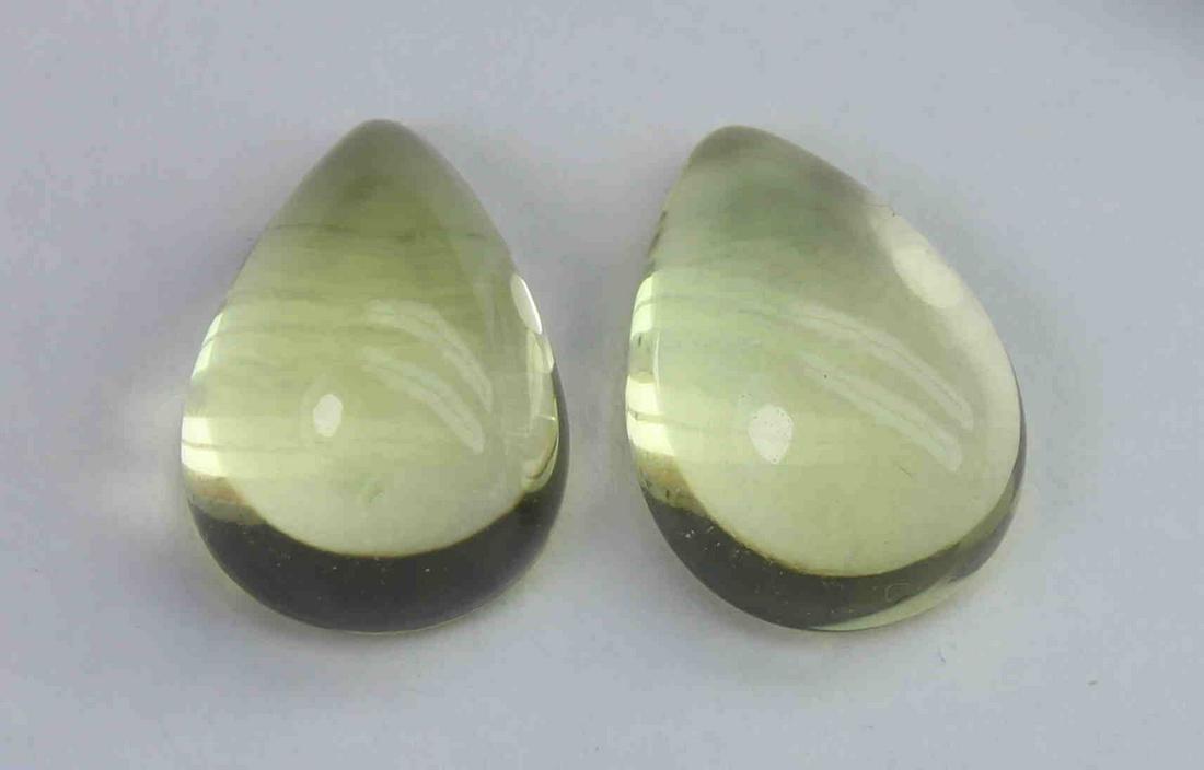 7.09 Ct Natural Lemon Quartz Lot: No Reserve! Title: 7.09 Ct Natural Lemon Quartz Lot Additional Information: Gemstone : Natural Lemon QuartzWeight : 7.09 CtShape : Pear CabochonColour : Greenish Yellow Dimensions : 10.7x8.3x6 mm , 11