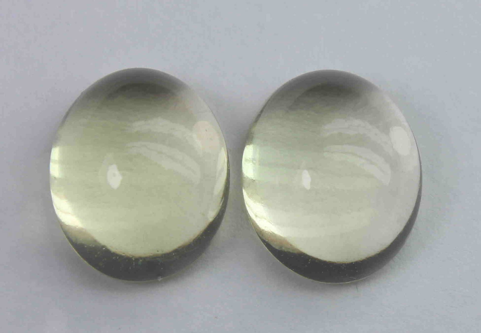 9.92 Ct Natural Lemon Quartz Lot: No Reserve! Title: 9.92 Ct Natural Lemon Quartz Lot Additional Information: Gemstone : Natural Lemon QuartzWeight : 9.92 CtShape : Oval CabochonColour : Greenish Yellow Dimensions : 11.7x9.7x6.2 mm, 1