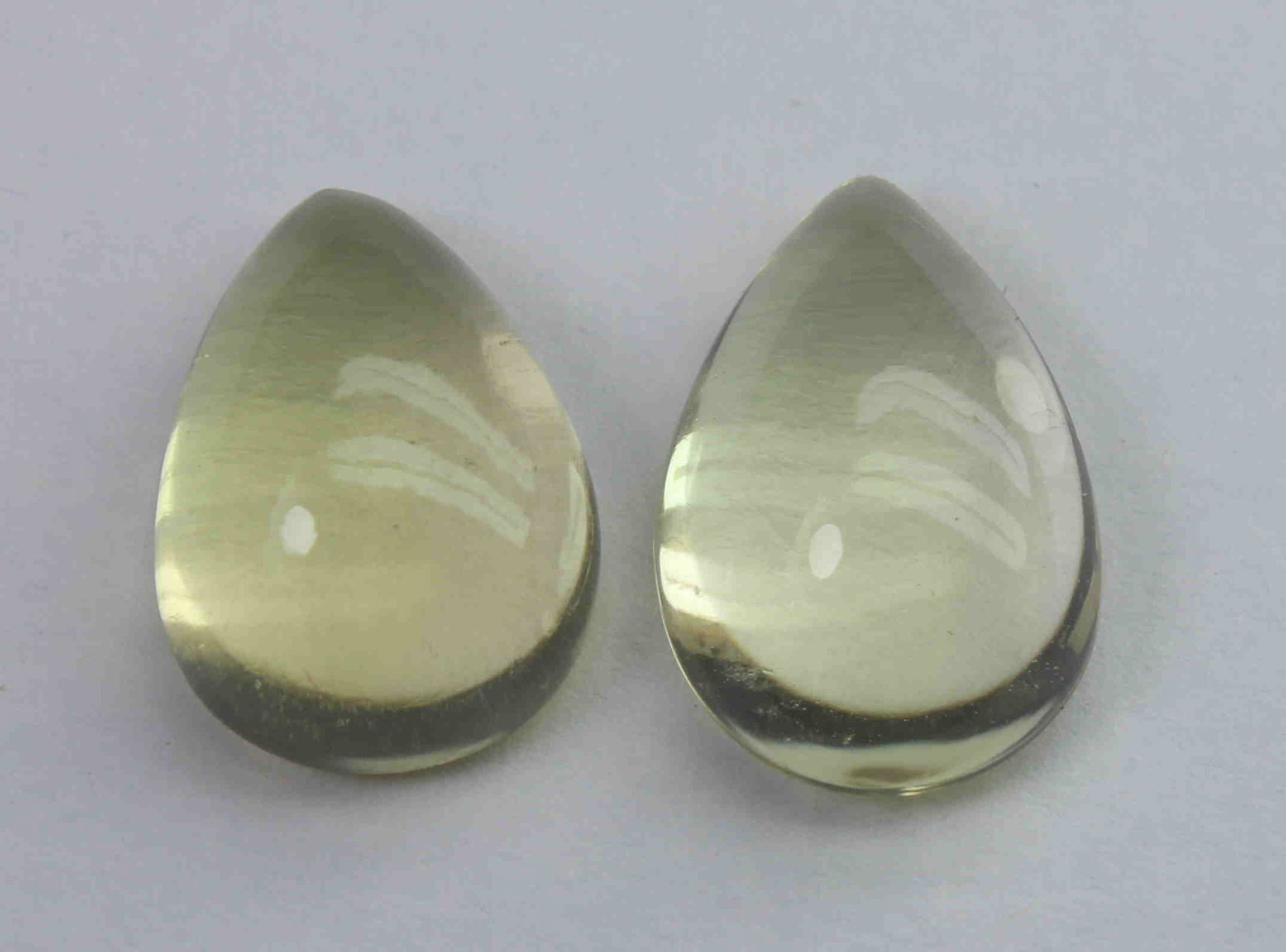 8.21 Ct Natural Lemon Quartz Lot: No Reserve! Title: 8.21 Ct Natural Lemon Quartz Lot Additional Information: Gemstone : Natural Lemon QuartzWeight : 8.21 CtShape : Pear CabochonColour : Greenish Yellow Dimensions : 13.4x9x5.3 mm , 13