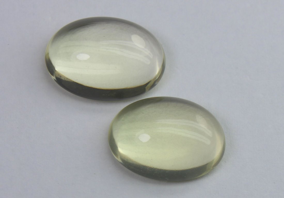 11.61 Ct Natural Lemon Quartz Lot: No Reserve! Title: 11.61 Ct Natural Lemon Quartz Lot Additional Information: Gemstone : Natural Lemon QuartzWeight : 11.61 CtShape : Oval CabochonColour : Greenish Yellow Dimensions : 14.3x10.5x5.6 mm