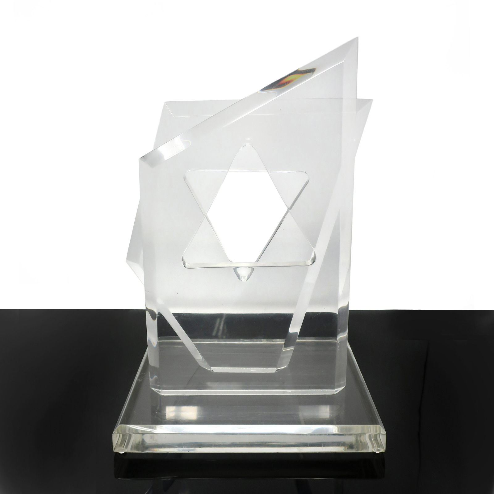 Lucite Star of David Sculpture by Hivo Van Teal: A beautiful piece of modernist sculpture by famed Lucite designer, Hivo Van Teal. Two vertical asymmetrical acrylic pieces mounted on a square base, which when viewed head on reveal a Star of David fo