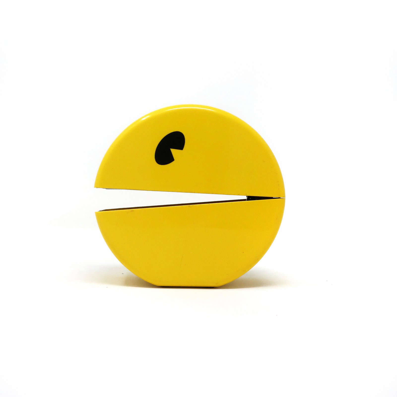 Vintage 1980s Pac Man Phone: An adorable vintage 1980s Pac Man flip phone by Bally Midway. Bright yellow and sits with the mouth slightly open. A great nostalgic design piece! Includes original instruction manual. Appears to be i