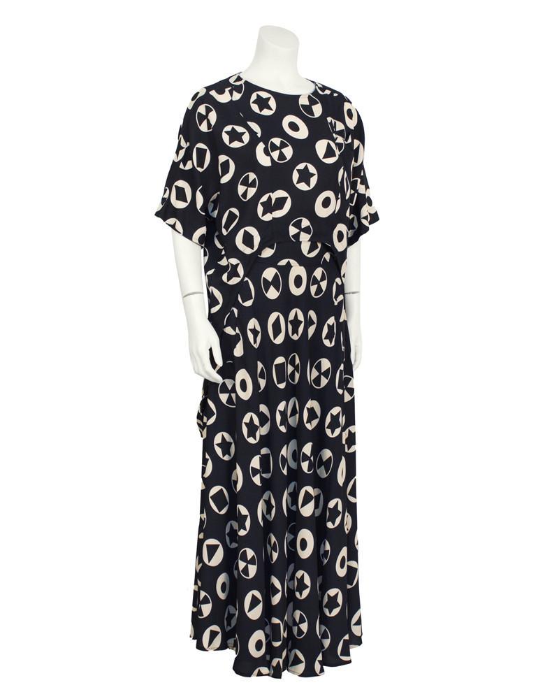 Fendi Black and White Printed Ensemble: Brand: Fendi Title: Black and White Printed Ensemble Additional Information: Late 70's Fendi rayon/viscose ensemble. The top features a high-low hem, a front pocket, and a short sleeved batwing with b